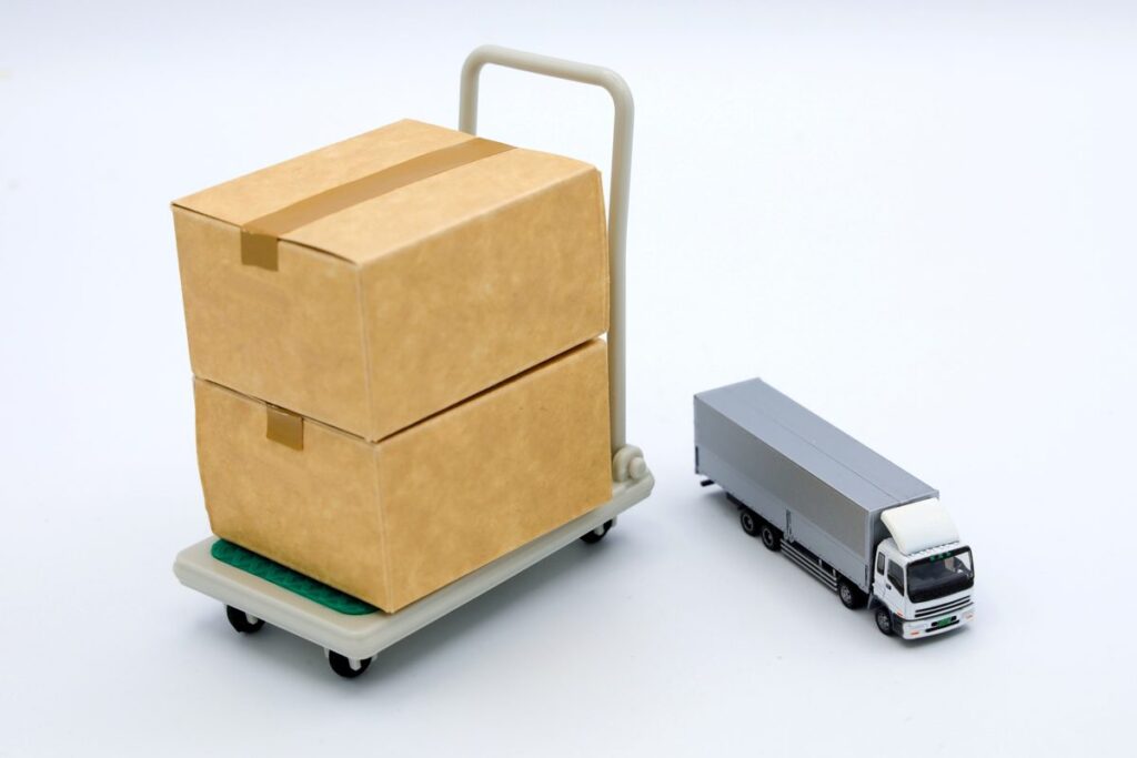 台車の荷物と配送トラックのイメージ